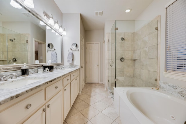 bathroom with tile patterned flooring, vanity, and independent shower and bath