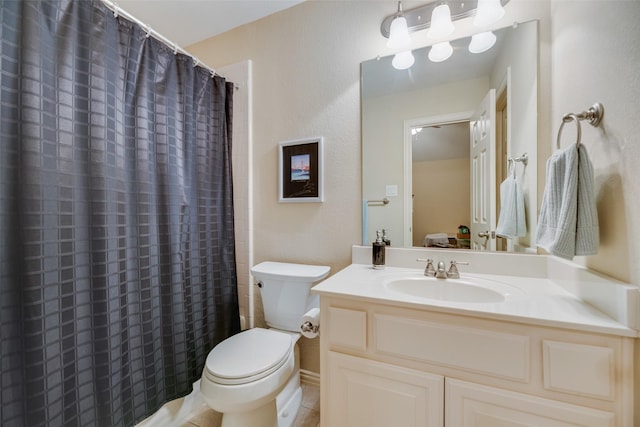 bathroom featuring toilet, vanity, tile patterned floors, and curtained shower