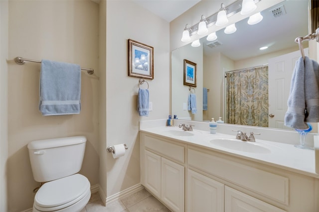 bathroom with tile patterned floors, a shower with curtain, vanity, and toilet