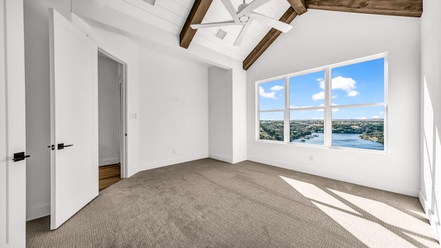 interior space featuring baseboards, high vaulted ceiling, and beam ceiling