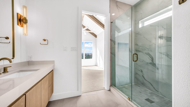 bathroom featuring vanity, tile patterned flooring, a marble finish shower, and a wealth of natural light