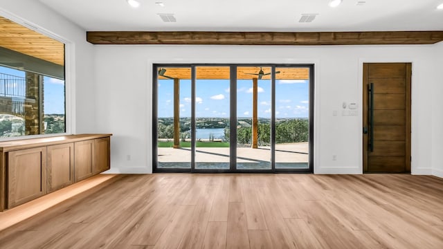 spare room with light wood-style floors, recessed lighting, visible vents, and baseboards