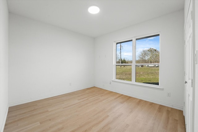 spare room featuring light hardwood / wood-style floors