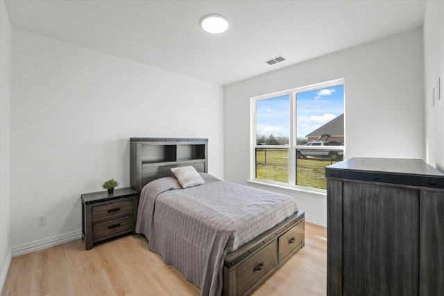 bedroom with light hardwood / wood-style floors