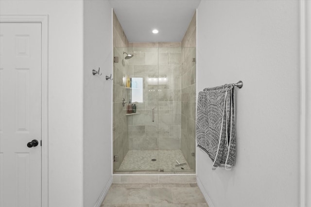 bathroom with tile patterned floors and walk in shower