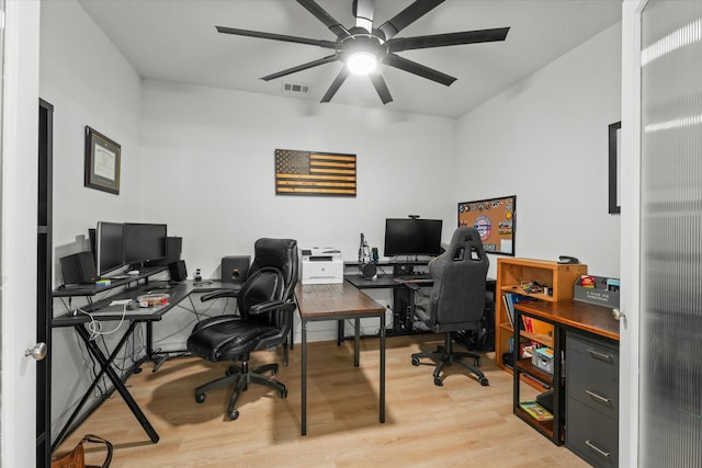 office with ceiling fan and light wood-type flooring