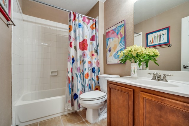 full bathroom featuring a textured wall, tile patterned flooring, toilet, vanity, and shower / bathtub combination with curtain