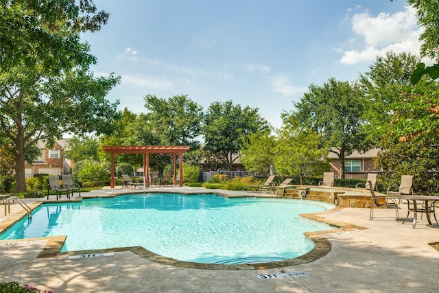 community pool featuring a patio area, fence, and a pergola