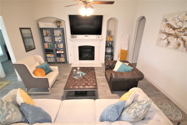 living room featuring hardwood / wood-style flooring and ceiling fan