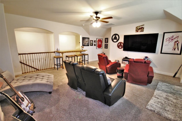 living room with ceiling fan, light carpet, and vaulted ceiling