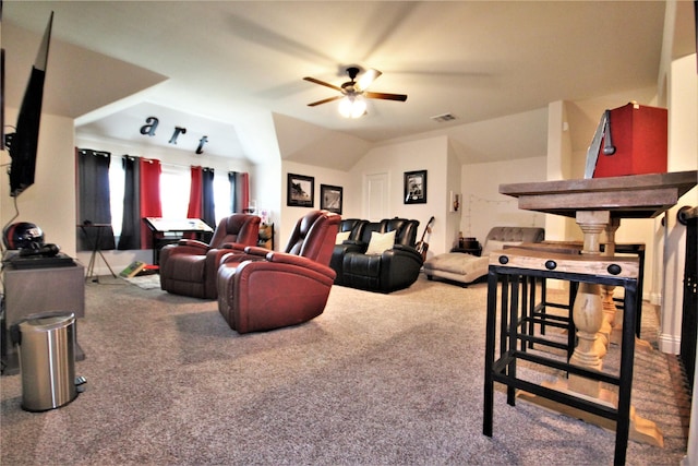 carpeted living room featuring ceiling fan and lofted ceiling