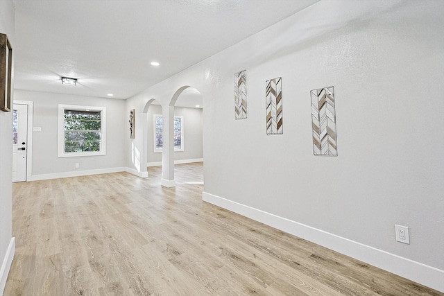 unfurnished living room with light hardwood / wood-style floors