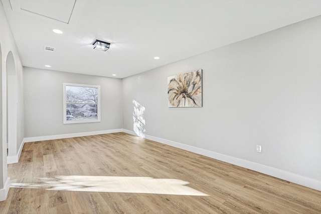 unfurnished room with light hardwood / wood-style flooring