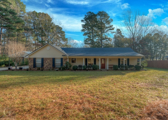 ranch-style home with a front lawn