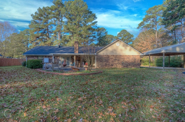 rear view of house with a lawn