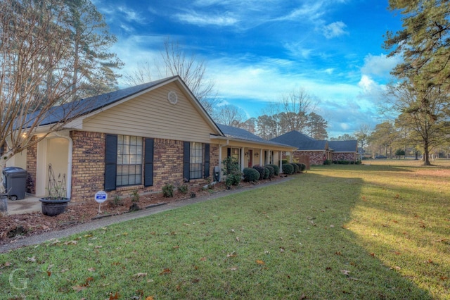 view of front facade with a front lawn