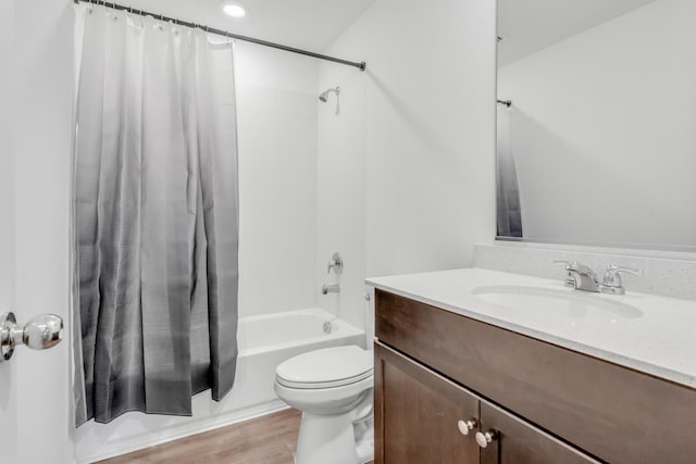 full bathroom with toilet, vanity, shower / bath combination with curtain, and hardwood / wood-style flooring