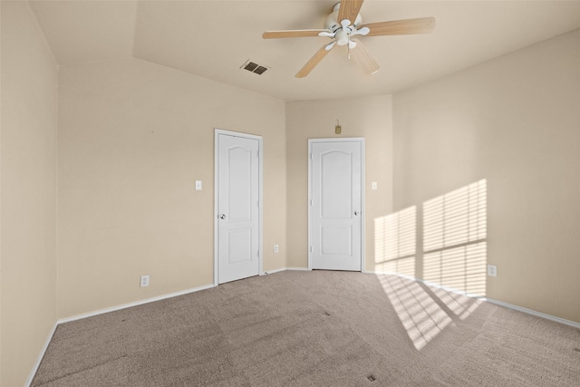 spare room with carpet flooring, ceiling fan, and vaulted ceiling