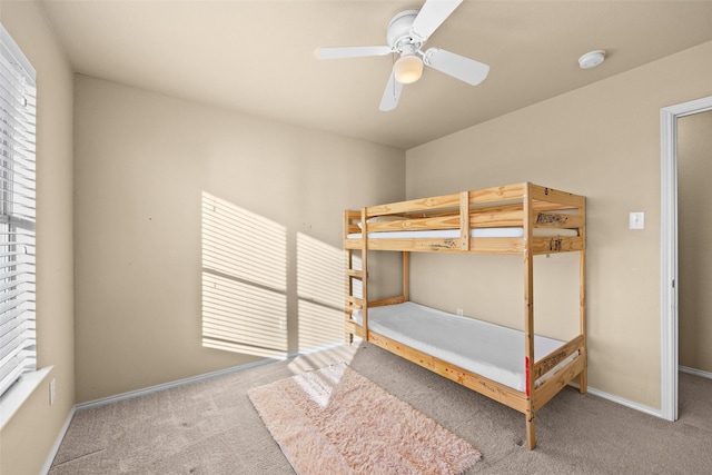 unfurnished bedroom with carpet flooring and ceiling fan