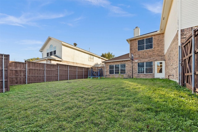 view of yard featuring a trampoline