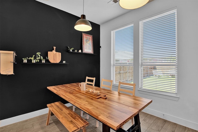 dining space featuring light wood-type flooring