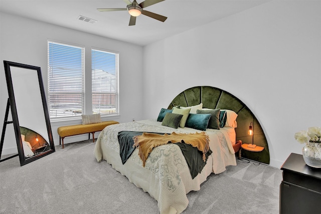 bedroom with ceiling fan and light carpet