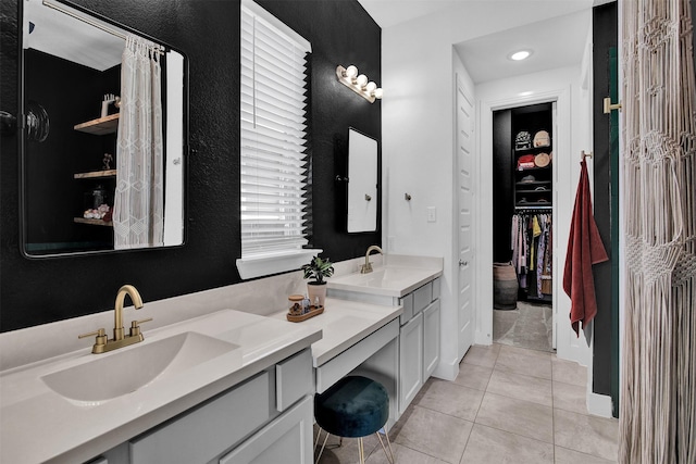 bathroom featuring tile patterned flooring and vanity