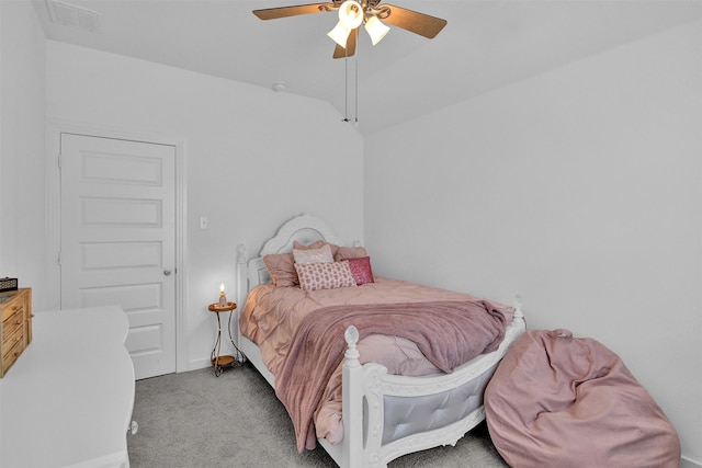 carpeted bedroom with ceiling fan and lofted ceiling