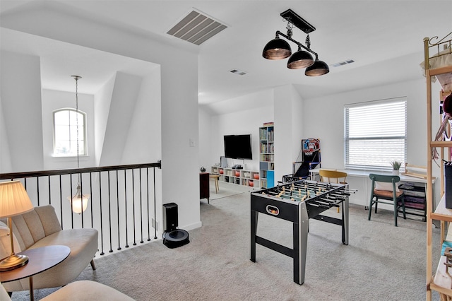 playroom with a wealth of natural light and light colored carpet