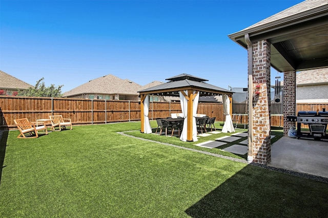 view of yard featuring a gazebo and a patio