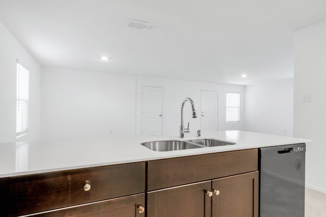 kitchen featuring black dishwasher and sink