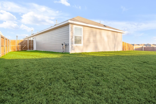 rear view of house with a yard