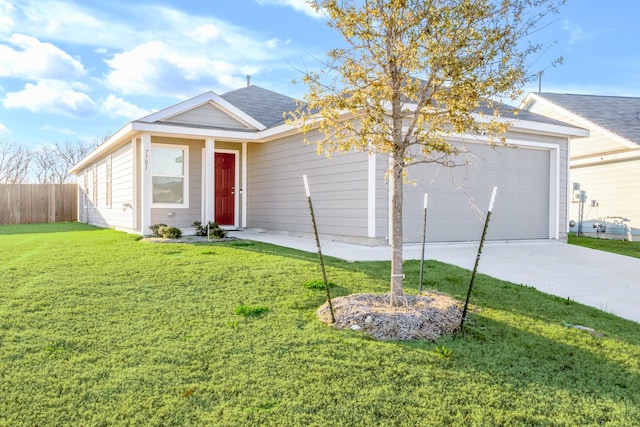 single story home featuring a garage and a front yard