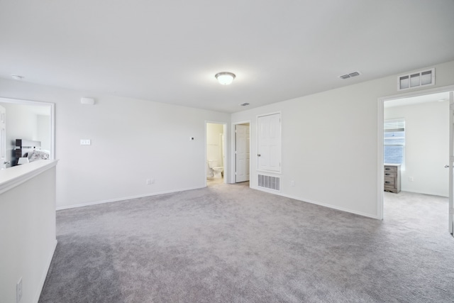 unfurnished room with carpet flooring