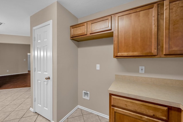 kitchen with light tile patterned flooring