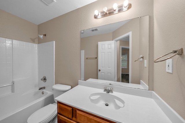 full bathroom with vanity, toilet, and washtub / shower combination