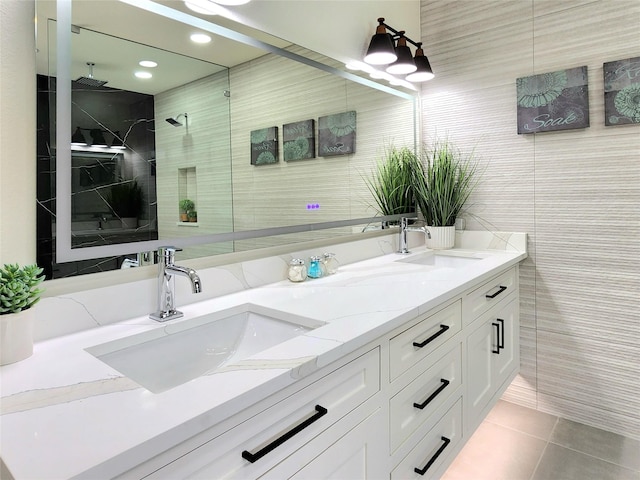 bathroom with vanity, tile patterned floors, walk in shower, and tile walls