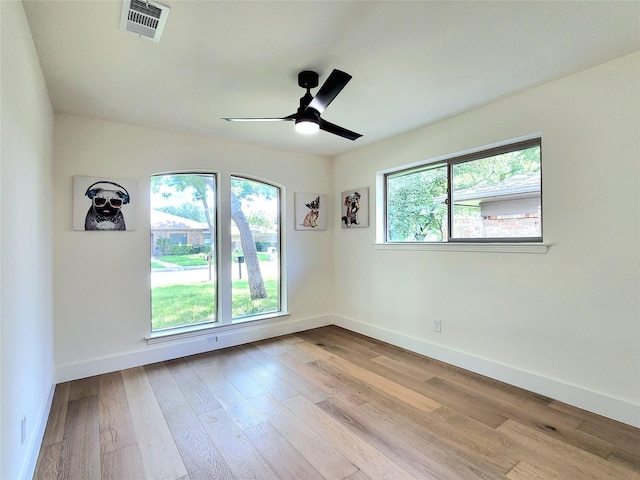 unfurnished room with ceiling fan and light hardwood / wood-style floors