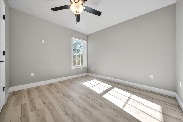 empty room with ceiling fan and light wood-type flooring