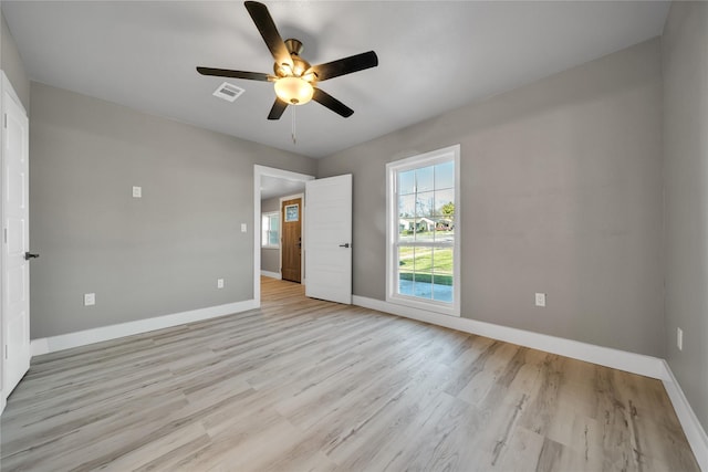 unfurnished bedroom featuring ceiling fan and light wood-type flooring