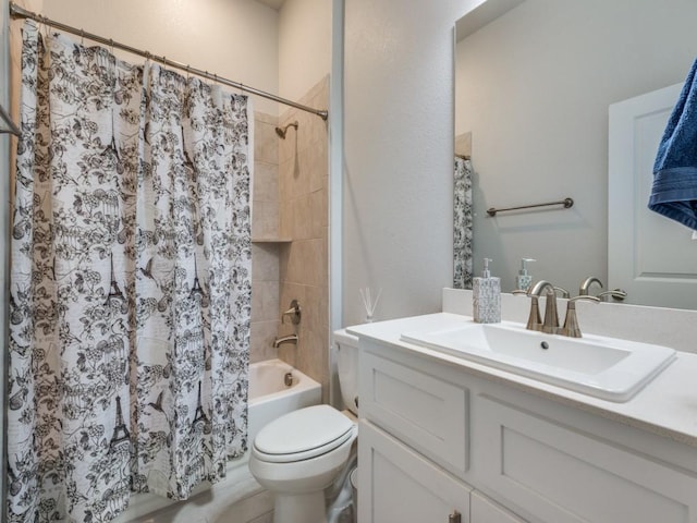 full bathroom featuring vanity, shower / tub combo, and toilet