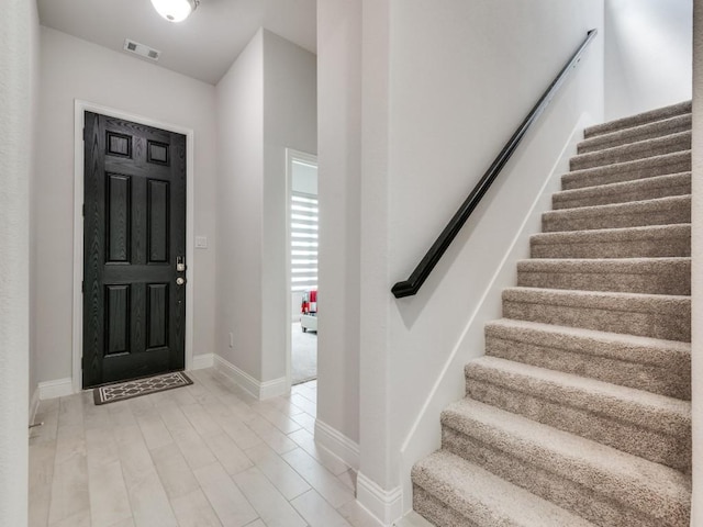 foyer with light hardwood / wood-style floors