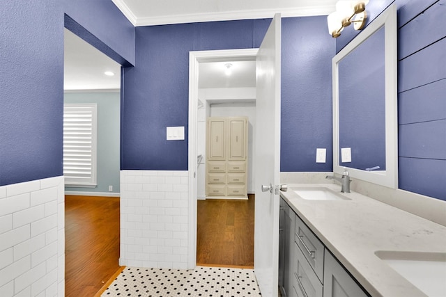 bathroom with ornamental molding, tile patterned floors, and vanity