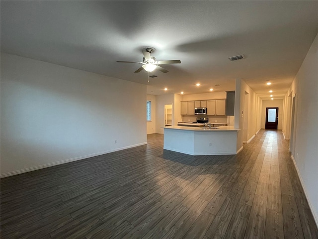 kitchen with white cabinetry, dark wood-type flooring, sink, and ceiling fan