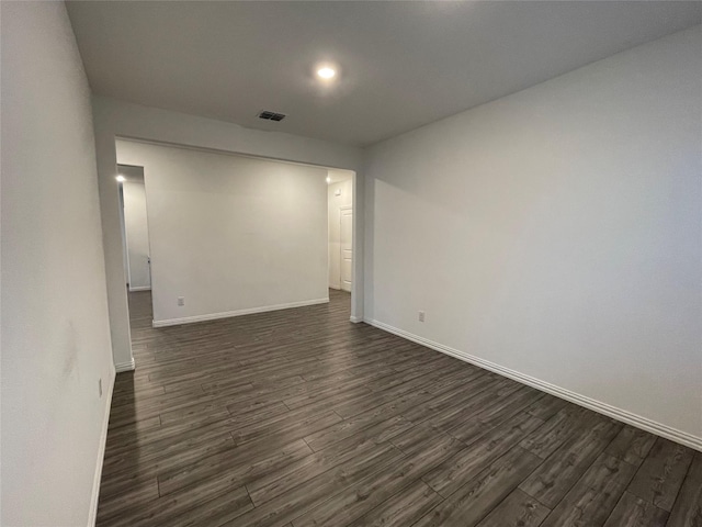 empty room featuring dark hardwood / wood-style flooring