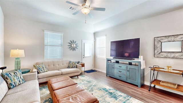 living room with ceiling fan, light hardwood / wood-style flooring, and plenty of natural light