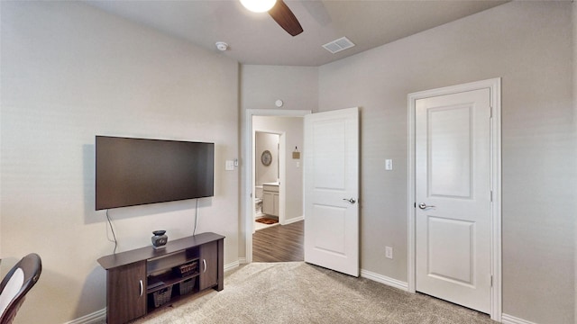 interior space with ceiling fan