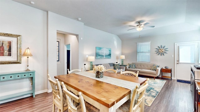 dining room featuring dark hardwood / wood-style floors and ceiling fan