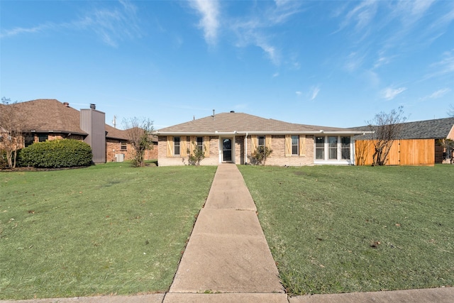 single story home featuring a front yard