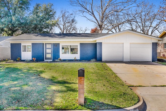 ranch-style home featuring a front lawn and a garage